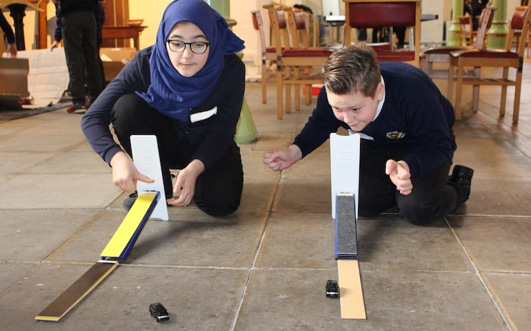 Physics in action at a community project supported by the Trust. Two children investigate forces.