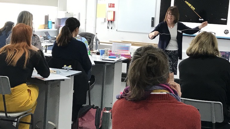 The photos shows Jackie Flaherty delivering a P3L course to teachers