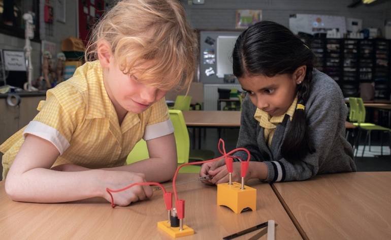 Two primary pupils taking part in a Phizzi electricity practical