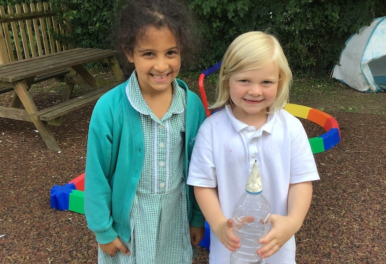 Two young pupils shows off their bottle rocket mice