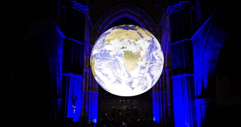 Gaia is a touring artwork by UK artist Luke Jerram. Measuring seven metres in diameter and created from 120dpi detailed NASA imagery of the Earth’s surface* the artwork provides the opportunity to see our planet, floating in three dimensions. 
